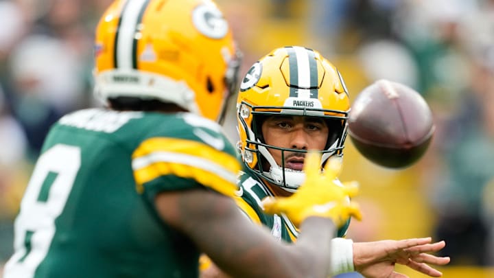 Green Bay Packers quarterback Jordan Love (10) tosses the ball to running back Josh Jacobs against Cincinnati. Green Bay Packers quarterback Jordan Love (10) tosses the ball to running back Josh Jacobs against Cincinnati.