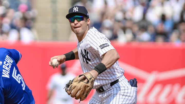 Sep 6, 2025; Bronx, New York, USA; New York Yankees shortstop Anthony Volpe (11) forces out Toronto Blue Jays outfielder Daulton Varsho (5) at second base but cannot complete the double play during the fourth inning at Yankee Stadium. Mandatory Credit: John Jones-Imagn Images