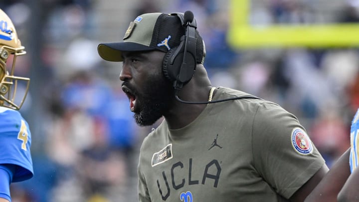 Nov 30, 2024; Pasadena, California, USA; UCLA Bruins head coach DeShaun Foster greets quarterback Ethan Garbers (4) during the third quarter against the Fresno State Bulldogs at Rose Bowl. Mandatory Credit: Robert Hanashiro-Imagn Images