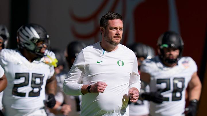 Oregon head coach Dan Lanning takes the field with his team for warmups as the Oregon Ducks take on the Texas Tech Red Raiders in the Orange Bowl on Jan. 1, 2026, at Hard Rock Stadium in Miami, Florida Oregon head coach Dan Lanning takes the field with his team for warmups as the Oregon Ducks take on the Texas Tech Red Raiders in the Orange Bowl on Jan. 1, 2026, at Hard Rock Stadium in Miami, Florida