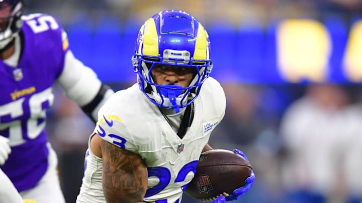 Oct 24, 2024; Inglewood, California, USA;  Los Angeles Rams running back Kyren Williams (23) runs the ball against Minnesota Vikings linebacker Ivan Pace Jr. (0) during the first half at SoFi Stadium. Mandatory Credit: Gary A. Vasquez-Imagn Images