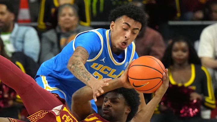 Jan 27, 2024; Los Angeles, California, USA; Southern California Trojans guard Bronny James (6) and UCLA Bruins forward Devin Williams (22) battle for the ball in the first half at Galen Center. Mandatory Credit: Kirby Lee-Imagn Images Jan 27, 2024; Los Angeles, California, USA; Southern California Trojans guard Bronny James (6) and UCLA Bruins forward Devin Williams (22) battle for the ball in the first half at Galen Center. Mandatory Credit: Kirby Lee-Imagn Images