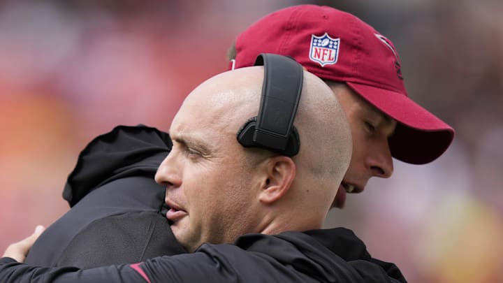 Arizona Cardinals head coach Jonathan Gannon (left) hugs Arizona Cardinals offensive coordinator Drew Petzing 