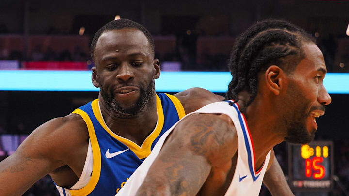 Nov 30, 2023; San Francisco, California, USA; Los Angeles Clippers forward Kawhi Leonard (2) controls the ball against Golden State Warriors forward Draymond Green (23) during the second quarter at Chase Center. Mandatory Credit: Kelley L Cox-Imagn Images Nov 30, 2023; San Francisco, California, USA; Los Angeles Clippers forward Kawhi Leonard (2) controls the ball against Golden State Warriors forward Draymond Green (23) during the second quarter at Chase Center. Mandatory Credit: Kelley L Cox-Imagn Images