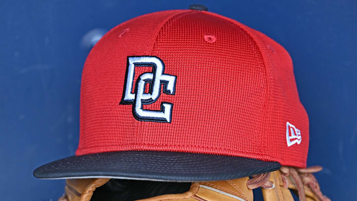 Aug 12, 2025; Kansas City, Missouri, USA; A Washington Nationals hat and glove in the dugout before a game against the Kansas City Royals at Kauffman Stadium. Aug 12, 2025; Kansas City, Missouri, USA; A Washington Nationals hat and glove in the dugout before a game against the Kansas City Royals at Kauffman Stadium.