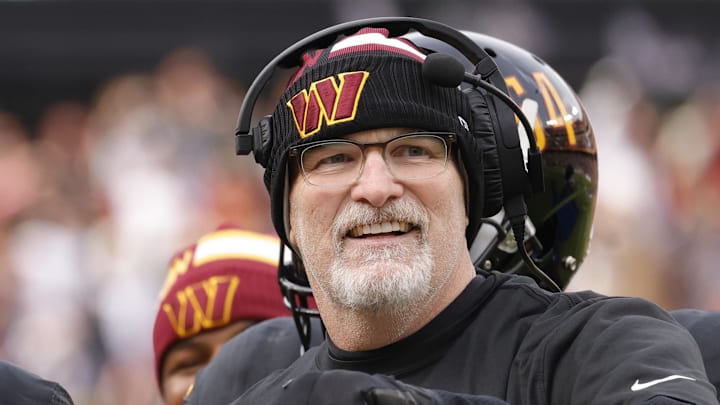 Dec 1, 2024; Landover, Maryland, USA; Washington Commanders head coach Dan Quinn (right) celebrates with Commanders running back Brian Robinson Jr. (8) after scoring a touchdown against the Tennessee Titans during the first half at Northwest Stadium. Mandatory Credit: Amber Searls-Imagn Images