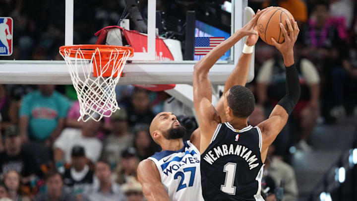 May 12, 2026; San Antonio, Texas, USA; San Antonio Spurs forward Victor Wembanyama (1) drives to the basket against Minnesota Timberwolves center Rudy Gobert (27) during the first half of Game 5 of the second round of the 2026 NBA Playoffs at Frost Bank Center.