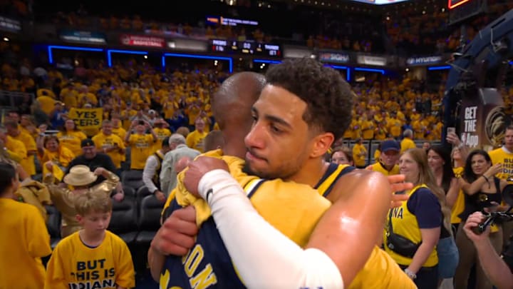 Tyrese Haliburton and Reggie Miller exchange a hug after the Indiana Pacers defeat the Oklahoma City Thunder in Game 3 of the NBA Finals.