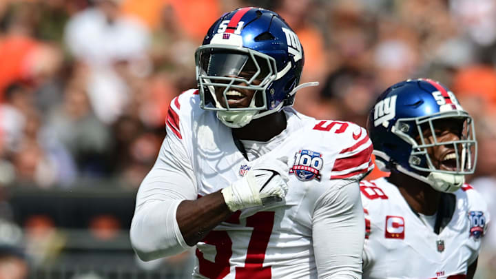 Sep 22, 2024; Cleveland, Ohio, USA; New York Giants linebacker Bobby Okereke (58) and New York Giants linebacker Azeez Ojulari (51) celebrate after a sack during the first quarter against the Cleveland Browns at Huntington Bank Field. Mandatory Credit: Ken Blaze-Imagn Images