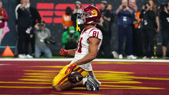 Dec 27, 2024; Las Vegas, NV, USA; iSouthern California Trojans wide receiver Kyle Ford (81) celebrates after scoring on a 7-yard touchdown reception against the Texas A&M Aggies at Allegiant Stadium. Mandatory Credit: Kirby Lee-Imagn Images