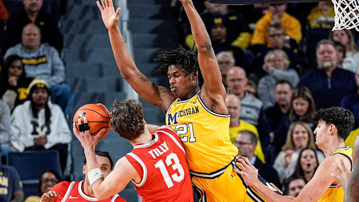 Michigan forward Morez Johnson Jr. (21) defends Ohio State center Christoph Tilly (13) during the first half at Crisler Center in Ann Arbor on Friday, Jan. 23, 2026. Michigan forward Morez Johnson Jr. (21) defends Ohio State center Christoph Tilly (13) during the first half at Crisler Center in Ann Arbor on Friday, Jan. 23, 2026.