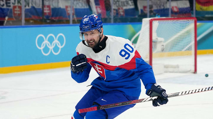 Feb 18, 2026; Milan, Italy; Tomas Tatar of Slovakia celebrates scoring their sixth goal in a men's ice hockey quarterfinal during the Milano Cortina 2026 Olympic Winter Games at Milano Santagiulia Ice Hockey Arena. Mandatory Credit: James Lang-Imagn Images