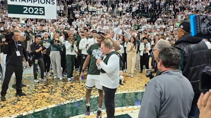 Michigan State head coach Tom Izzo and guard Tre Holloman celebrate the Spartans' Big Ten championship.