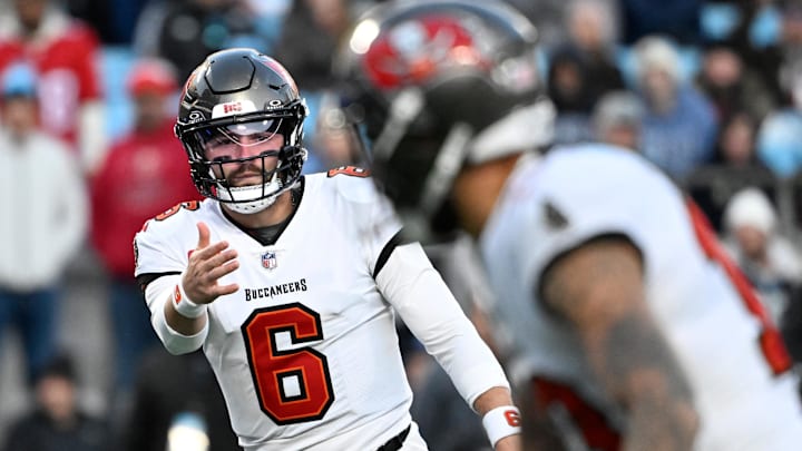 Dec 1, 2024; Charlotte, North Carolina, USA;  Tampa Bay Buccaneers quarterback Baker Mayfield (6) signals to wide receiver Mike Evans (13) in the first quarter at Bank of America Stadium. Mandatory Credit: Bob Donnan-Imagn Images