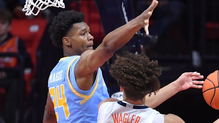 Southern University Jaguars forward Ashton Magee (24) blocks the way of Illinois Fighting Illini guard Keaton Wagler (23) during the second half at State Farm Center.