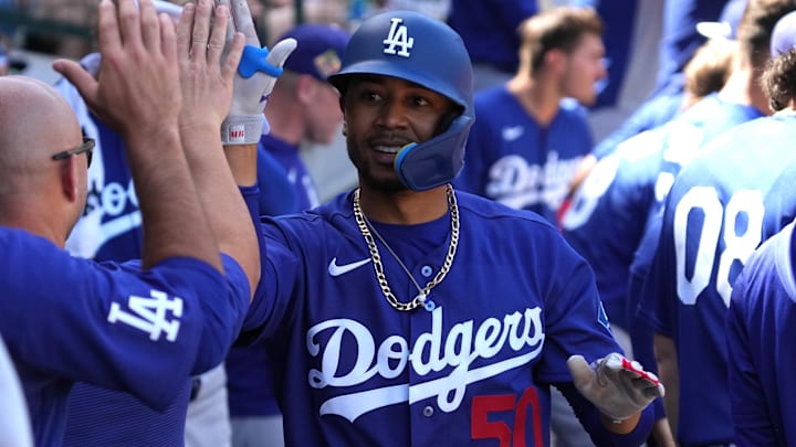 Dodgers shortstop Mookie Betts celebrates in the dugout after hitting a home run.