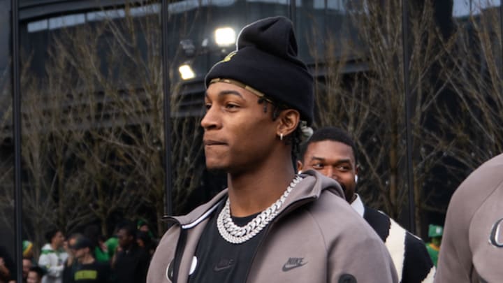 oregon ducks evan stewart name image likeness nil dakorien moore dan lanning college football playoff injury dante moore