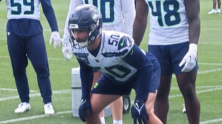 Seattle Seahawks linebacker Patrick O'Connell participates in a sled drill at OTAs.