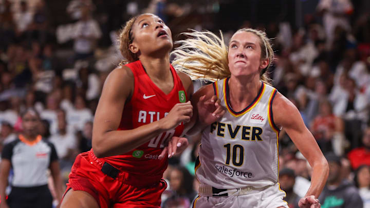 Sep 14, 2025; College Park, Georgia, USA; Atlanta Dream forward Naz Hillmon (00) boxes out Indiana Fever guard Lexie Hull (10) in the second quarter during game one of round one for the 2025 WNBA Playoffs at Gateway Center Arena at College Park. Mandatory Credit: Brett Davis-Imagn Images
