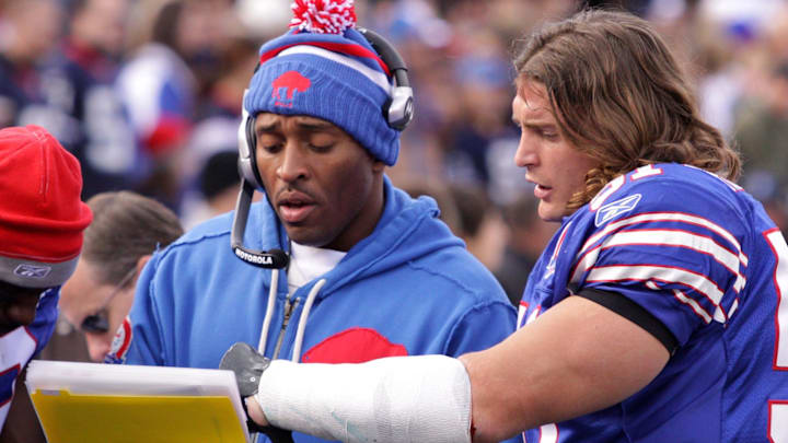 Buffalo Bills linebacker Paul Posluszny (51) discusses plays with linebacker coach DeMontie Cross (left) on the sideline in a game against the Miami Dolphins on Nov. 29, 2009, at Ralph Wilson Stadium. Bills beat the Dolphins 31-14. Buffalo Bills linebacker Paul Posluszny (51) discusses plays with linebacker coach DeMontie Cross (left) on the sideline in a game against the Miami Dolphins on Nov. 29, 2009, at Ralph Wilson Stadium. Bills beat the Dolphins 31-14.