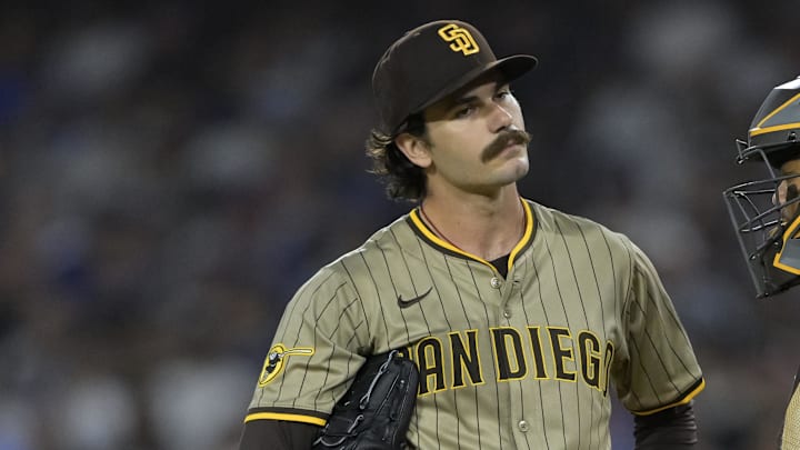 Jun 16, 2025; Los Angeles, California, USA; San Diego Padres starting pitcher Dylan Cease (84) and catcher Martin Maldonado (15) during a mound visit in the fourth inning against the Los Angeles Dodgers at Dodger Stadium. Mandatory Credit: Jayne Kamin-Oncea-Imagn Images