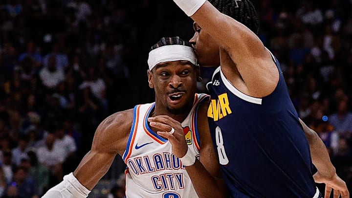 May 11, 2025; Denver, Colorado, USA; Oklahoma City Thunder guard Shai Gilgeous-Alexander (2) controls the ball against Denver Nuggets forward Peyton Watson (8) in the first quarter during game four of the second round of the 2025 NBA Playoffs at Ball Arena. Mandatory Credit: Isaiah J. Downing-Imagn Images