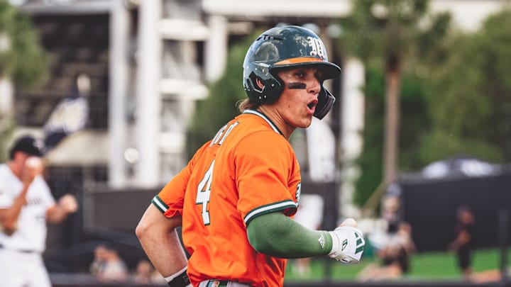 Miami Hurricanes second baseman Jake Ogden ( No. 4) after a home run in the first inning against UCF.