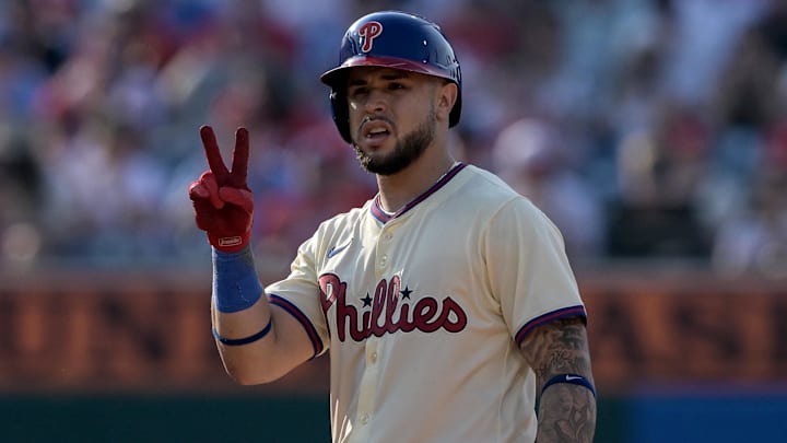 Jun 22, 2024; Philadelphia, Pennsylvania, USA;  Philadelphia Phillies catcher Rafael Marchan (13) reacts after hitting a double against the Arizona Diamondbacks in the seventh inning at Citizens Bank Park. The Phillies won 12-1