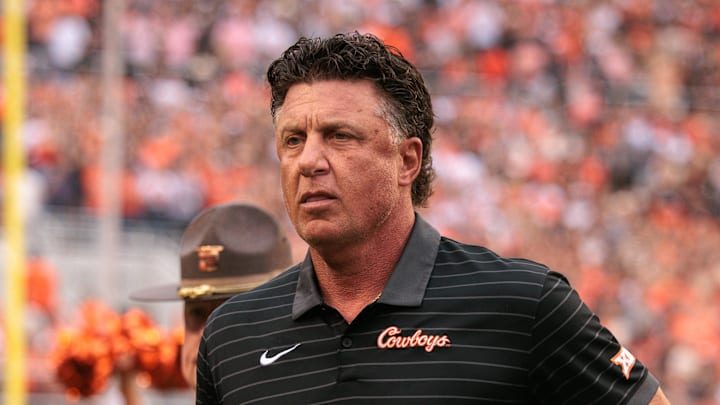 Aug 28, 2025; Stillwater, Oklahoma, USA; Oklahoma State Cowboys coach Mike Gundy takes the field prior to the game against the Tennessee Martin Skyhawks at Boone Pickens Stadium. Mandatory Credit: William Purnell-Imagn Images