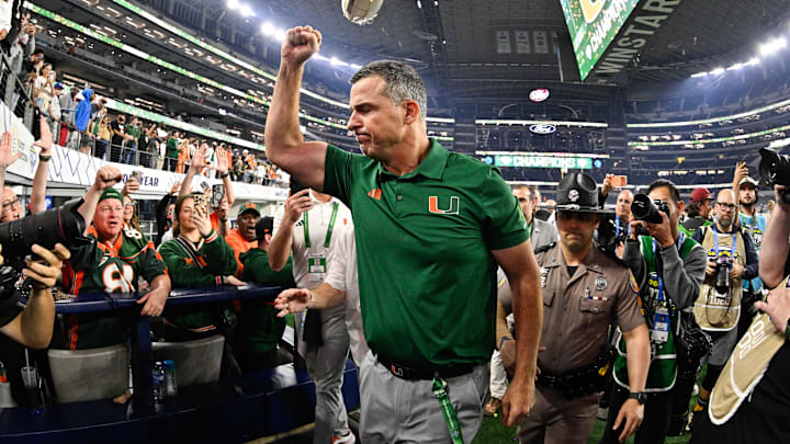 Dec 31, 2025; Arlington, TX, USA; Miami Hurricanes head coach Mario Cristobal celebrates defeating the Ohio State Buckeyes during the 2025 Cotton Bowl and quarterfinal game of the College Football Playoff at AT&T Stadium. Mandatory Credit: Jerome Miron-Imagn Images Dec 31, 2025; Arlington, TX, USA; Miami Hurricanes head coach Mario Cristobal celebrates defeating the Ohio State Buckeyes during the 2025 Cotton Bowl and quarterfinal game of the College Football Playoff at AT&T Stadium. Mandatory Credit: Jerome Miron-Imagn Images
