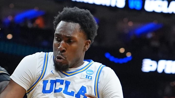 Mar 20, 2026; Philadelphia, PA, USA;UCF Knights center John Bol (7) grabs a rebound againist UCLA Bruins center Xavier Booker (1) in the first half during a first round game of the men's 2026 NCAA Tournament at Xfinity Mobile Arena. Mandatory Credit: Kyle Ross-Imagn Images Mar 20, 2026; Philadelphia, PA, USA;UCF Knights center John Bol (7) grabs a rebound againist UCLA Bruins center Xavier Booker (1) in the first half during a first round game of the men's 2026 NCAA Tournament at Xfinity Mobile Arena. Mandatory Credit: Kyle Ross-Imagn Images