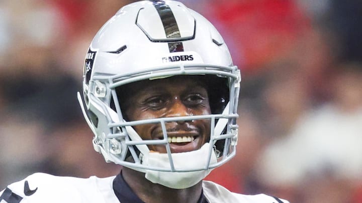 Dec 21, 2025; Houston, Texas, USA; Las Vegas Raiders quarterback Geno Smith (7) reacts after throwing a touchdown pass against the Houston Texans during the second quarter at NRG Stadium. Mandatory Credit: Troy Taormina-Imagn Images