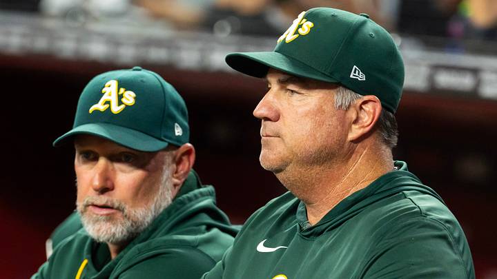 Jul 21, 2026; Phoenix, Arizona, USA; Athletics pitching coach Dan Hubbs (right) with manager Mark Kotsay against the Arizona Diamondbacks at Chase Field. Mandatory Credit: Mark J. Rebilas-Imagn Images