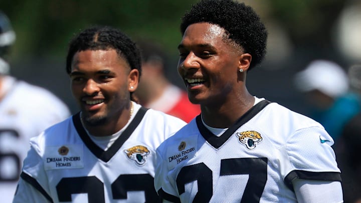 Jacksonville Jaguars cornerback Caleb Ransaw (27) smiles with safety Cam'Ron Silmon-Craig (32) during the second mandatory minicamp at Miller Electric Center Wednesday, June 11, 2025 in Jacksonville, Fla.