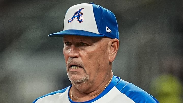  Atlanta Braves manager Brian Snitker (43) walks to the mound to change pitchers against the New York Mets during the seventh inning at Truist Park.