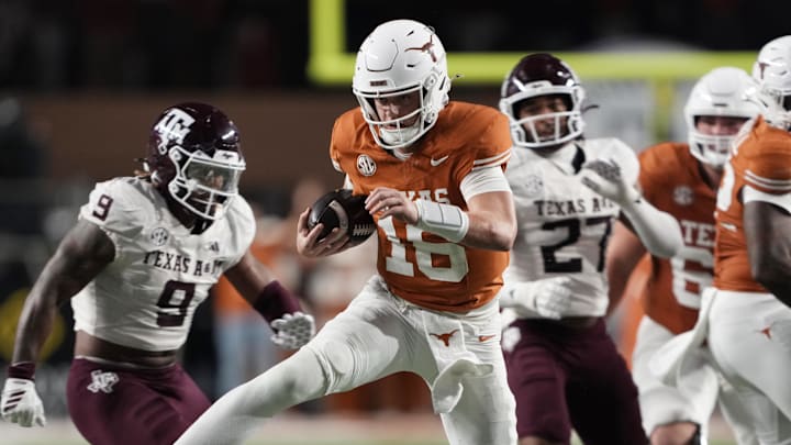 Texas Longhorns quarterback Arch Manning keeps the ball and runs for a touchdown during the second half against the Texas A&M Aggies at Darrell K Royal-Texas Memorial Stadium.