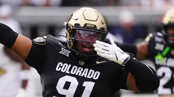 Aug 29, 2025; Boulder, Colorado, USA; Colorado Buffaloes defensive end Brandon Davis-Swain (91) reacts to a turnover in the first quarter against the Georgia Tech Yellow Jackets at Folsom Field. Mandatory Credit: Ron Chenoy-Imagn Images