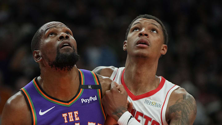 Mar 30, 2025; Phoenix, Arizona, USA; Phoenix Suns forward Kevin Durant (35) and Houston Rockets forward Jabari Smith Jr. (10) fight for position in the first half at Footprint Center. Mandatory Credit: Rick Scuteri-Imagn Images