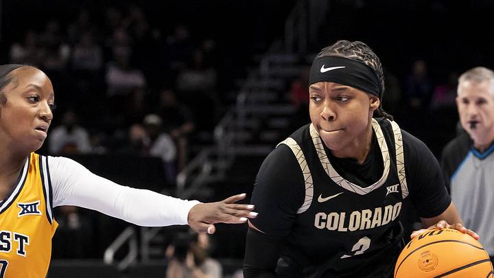 Mar 7, 2026; Kansas City, MO, USA;  Colorado Buffaloes guard Desiree Wooten (3) edges around West Virginia Mountaineers guard Jordan Harrison (10) during the first half at T-Mobile Center. Mandatory Credit: Nick Tre. Smith-Imagn Images