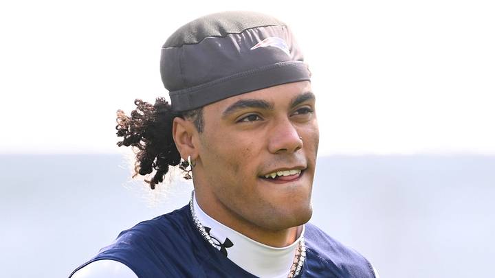 Jul 28, 2026; Foxborough, MA, USA; New England Patriots cornerback Christian Gonzalez (0) walks to practice for training camp at Gillette Stadium. Mandatory Credit: Eric Canha-Imagn Images
