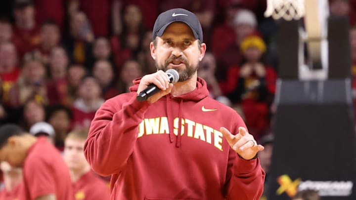 Dec 11, 2025; Ames, Iowa, USA; Iowa State Cyclones new football coach Jimmy Rogers speaks during the Cyclones game with the Iowa Hawkeyes during the first half at James H. Hilton Coliseum. Dec 11, 2025; Ames, Iowa, USA; Iowa State Cyclones new football coach Jimmy Rogers speaks during the Cyclones game with the Iowa Hawkeyes during the first half at James H. Hilton Coliseum.