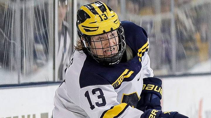 Michigan center TJ Hughes makes a pass against Michigan State defenseman Nash Nienhuis during the third period at Yost Ice Arena in Ann Arbor on Friday, Feb. 9, 2024. Michigan center TJ Hughes makes a pass against Michigan State defenseman Nash Nienhuis during the third period at Yost Ice Arena in Ann Arbor on Friday, Feb. 9, 2024.
