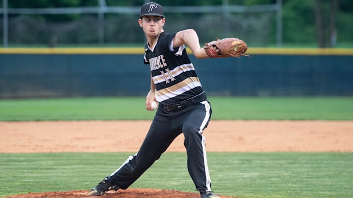 Providence's Michael Forret (11) pitches during their game at Roberson on May 27, 2022. The Providence Panthers defeated the Roberson Rams 3-0. Providence's Michael Forret (11) pitches during their game at Roberson on May 27, 2022. The Providence Panthers defeated the Roberson Rams 3-0.