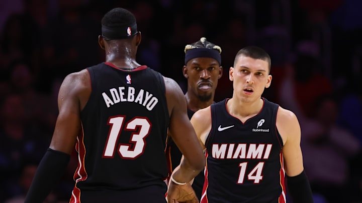 Nov 4, 2024; Miami, Florida, USA; Miami Heat guard Tyler Herro (14) celebrates with Miami Heat center Bam Adebayo (13) after scoring against the Sacramento Kings during the fourth quarter at Kaseya Center.