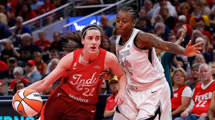 Indiana Fever guard Caitlin Clark drives past Las Vegas Aces guard Jewell Loyd in the first half of play. Indiana Fever guard Caitlin Clark drives past Las Vegas Aces guard Jewell Loyd in the first half of play.