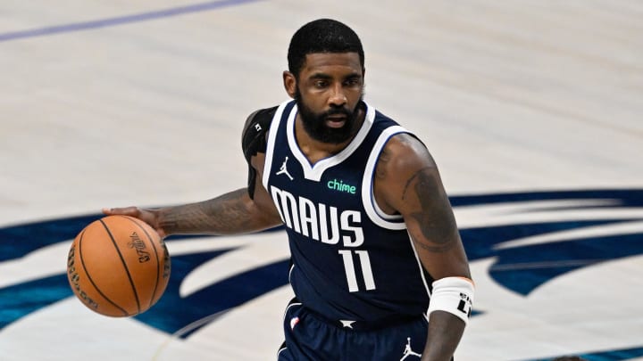 Jun 14, 2024; Dallas, Texas, USA; Dallas Mavericks guard Kyrie Irving (11) dribbles against the Boston Celtics during the second half of game four of the 2024 NBA Finals at American Airlines Center. Mandatory Credit: Jerome Miron-USA TODAY Sports