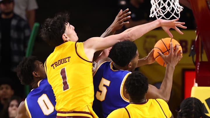 Jan 21, 2026; Tempe, Arizona, USA; Arizona State Sun Devils forward Santiago Trouet (1) defends against West Virginia Mountaineers forward DJ Thomas (5) in the second half at Desert Financial Arena. Mandatory Credit: Mark J. Rebilas-Imagn Images