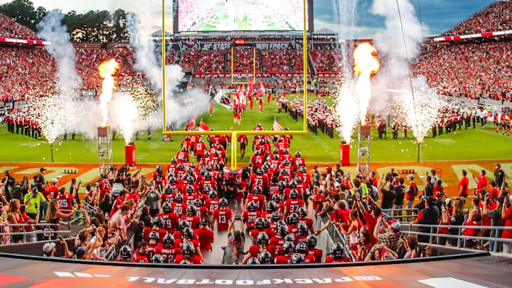 Sep 27, 2025; Raleigh, North Carolina, USA; The North Carolina State Wolfpack takes to the field before the first half of the game against Virginia Tech Hokies at Carter-Finley Stadium. Mandatory Credit: Jaylynn Nash-Imagn Images Sep 27, 2025; Raleigh, North Carolina, USA; The North Carolina State Wolfpack takes to the field before the first half of the game against Virginia Tech Hokies at Carter-Finley Stadium. Mandatory Credit: Jaylynn Nash-Imagn Images