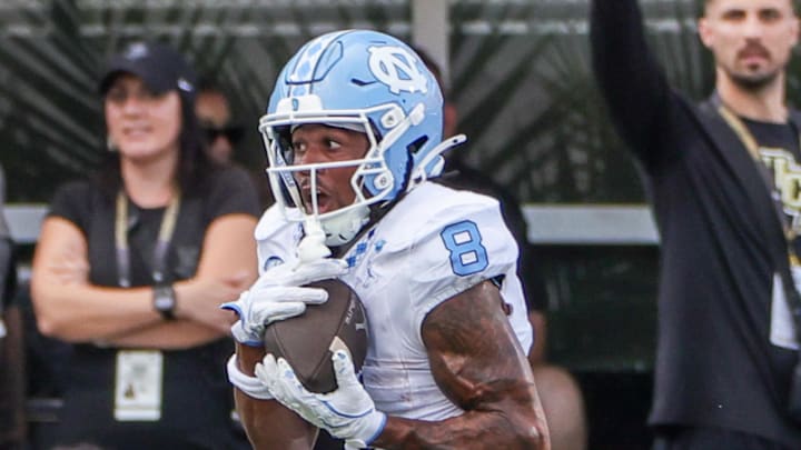Sep 20, 2025; Orlando, Florida, USA; North Carolina Tar Heels wide receiver Kobe Paysour (8) runs the ball during the second half against the UCF Knights at the Bounce House Stadium. Sep 20, 2025; Orlando, Florida, USA; North Carolina Tar Heels wide receiver Kobe Paysour (8) runs the ball during the second half against the UCF Knights at the Bounce House Stadium.