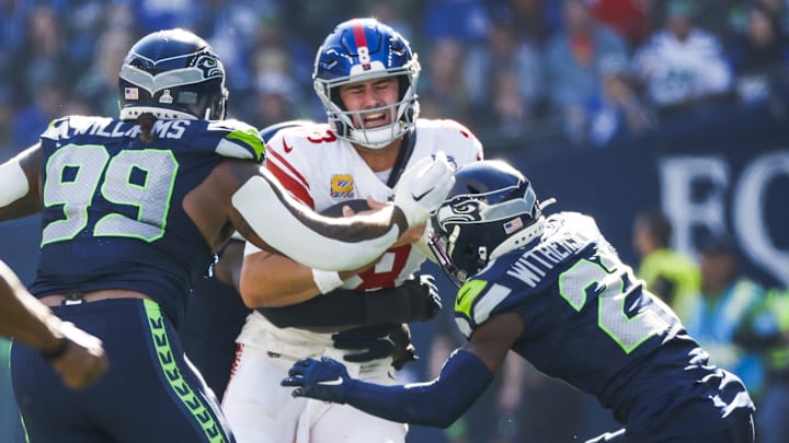 Oct 6, 2024; Seattle, Washington, USA; New York Giants quarterback Daniel Jones (8) rushes against the Seattle Seahawks during the second quarter at Lumen Field.